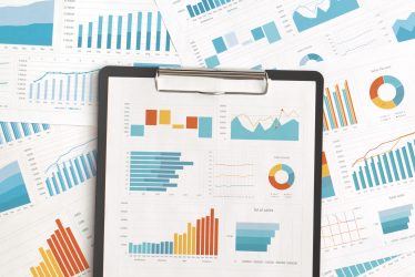 Business graphs and charts on table. Financial development, Banking Account, Statistics
