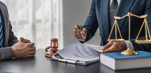 Consultation and conference of lawyers and professional businessman working and discussion having at law firm in office. Concepts of law, Judge gavel with scales of justice..